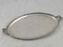 Appraisal: A two handled oval silver serving tray with gadrooned rim