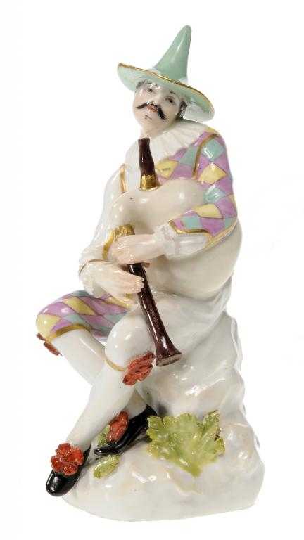 Appraisal: A MEISSEN FIGURE OF HARLEQUIN modelled possibly by J F