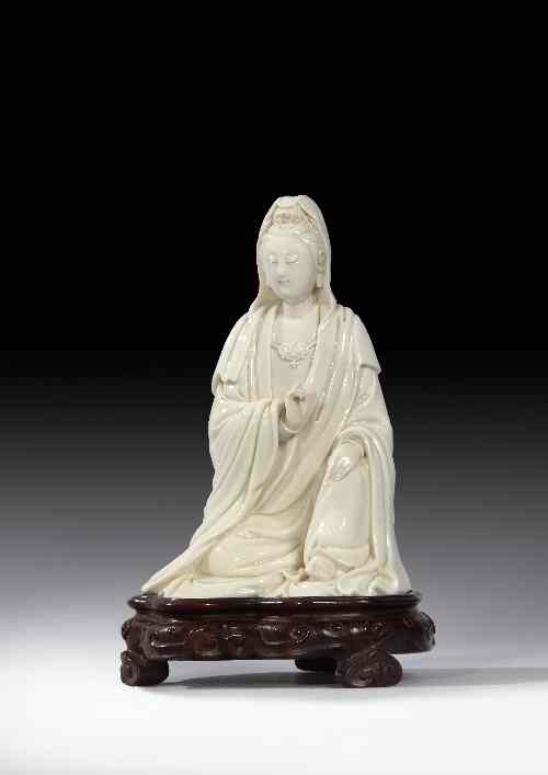 Appraisal: A Chinese Dehua porcelain 'blanc-de-chine' seated figure of Guanyin ins