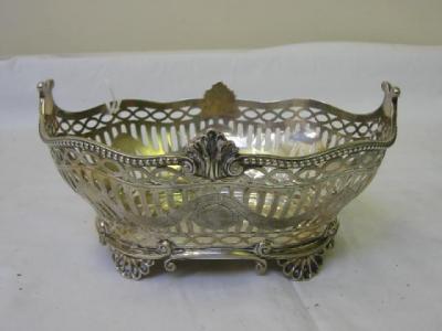 Appraisal: A VICTORIAN FRUIT BASKET of oval form the sides pierced