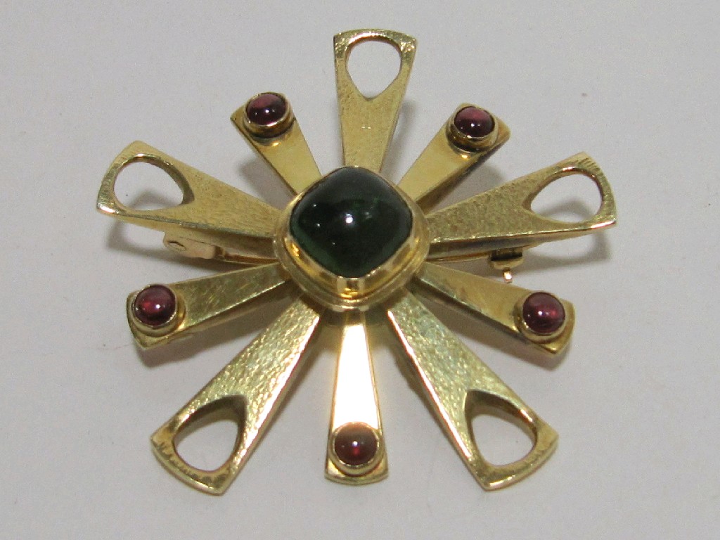 Appraisal: Eighteen carat gold stylized starburst brooch with central cabochon emerald