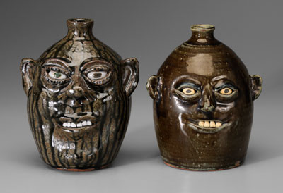 Appraisal: Two Meaders Face Jugs Georgia th century one with runny