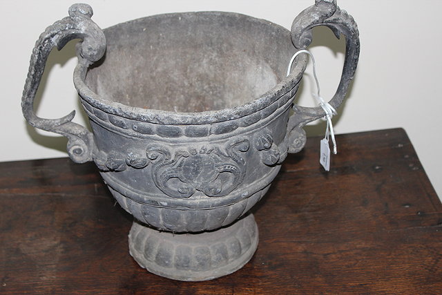 Appraisal: AN ANTIQUE LEAD URN with scrolling handles applied with husk