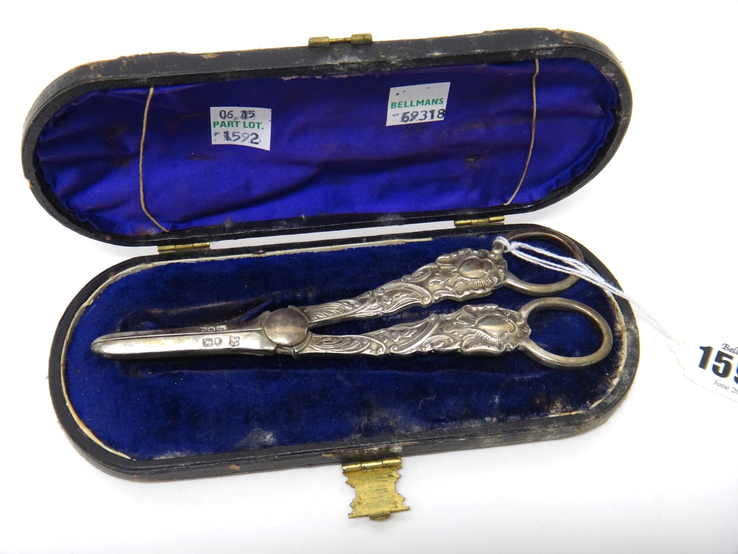 Appraisal: A pair of silver grape scissors with cast floral and