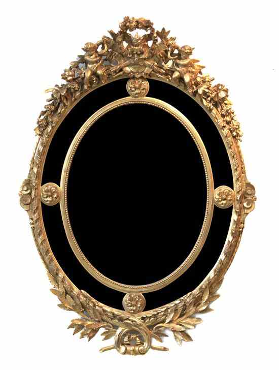 Appraisal: A French Giltwood Mirror having a carved crest in the