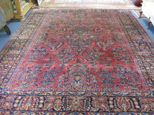 Appraisal: Sarouk Persian Handmade Room Size Rug elaborate florals on burgundy