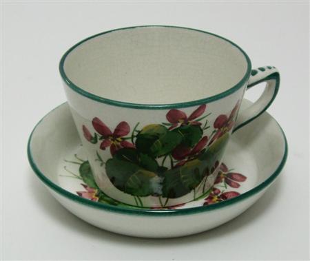 Appraisal: WEMYSS TEA CUP SAUCER CIRCA decorated by James Sharp with