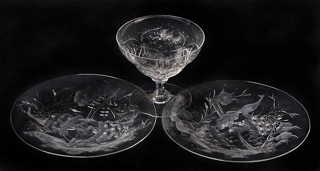 Appraisal: A PAIR OF TH CENTURY GLASS PLATES decorated with prunus