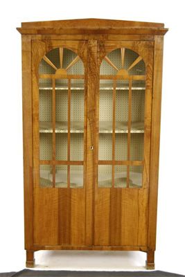 Appraisal: A Biedermeier style walnut display cabinet with a pair of