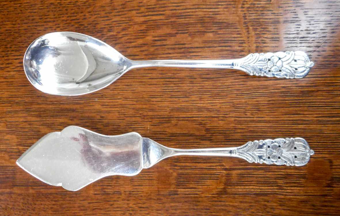 Appraisal: SET OF TWO PERUVIAN STERLING SILVER FLATWARE PIECES casserole spoon