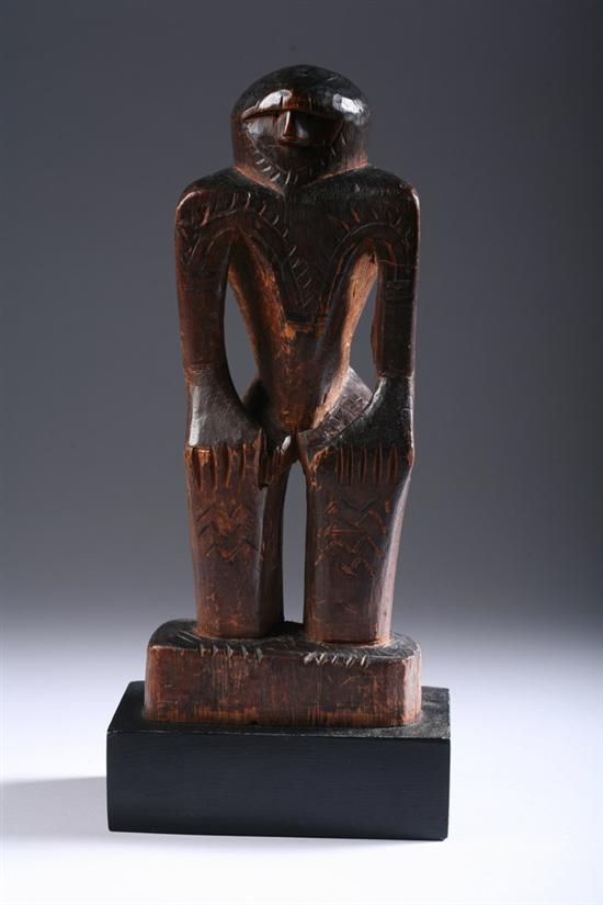 Appraisal: ALASKAN WOOD FIGURE OF IDOL Incised day - in high