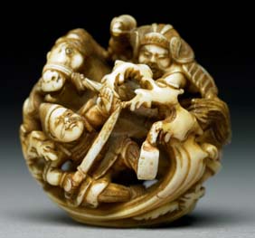 Appraisal: ANTIQUE IVORY NETSUKE Finely and openwork carved antique stained ivory