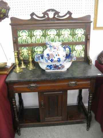 Appraisal: Victorian Washstand marble top tilesplashback single drawer withlower door shelves