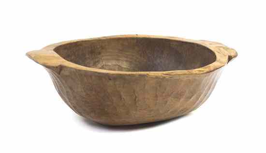 Appraisal: A French Carved Pine Dough Bowl of oval form with