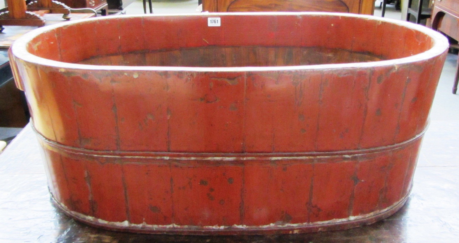 Appraisal: A red painted Chinese cooper made two handled wooden tub