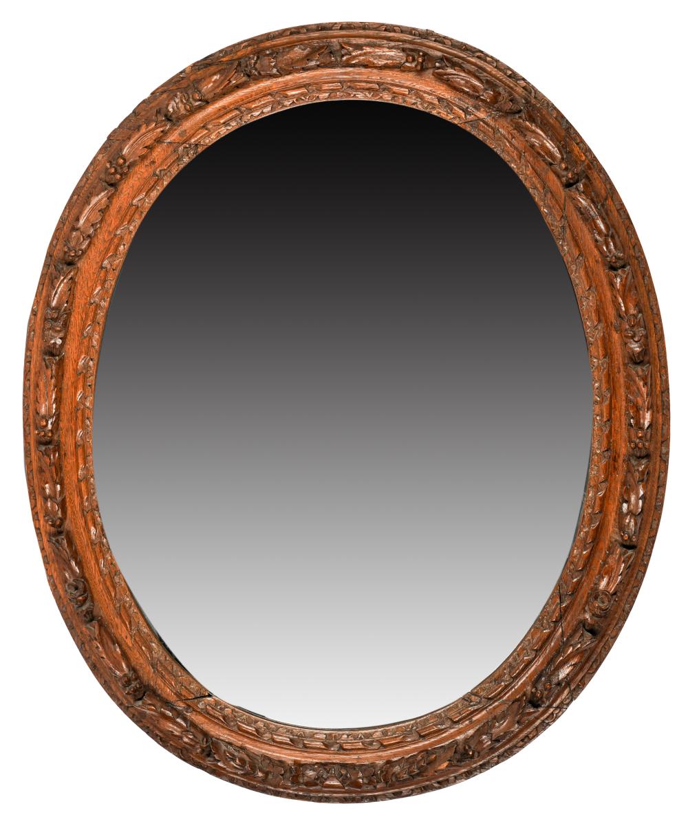 Appraisal: OVAL CARVED OAK MIRRORcirca with beveled mirror plate x inches