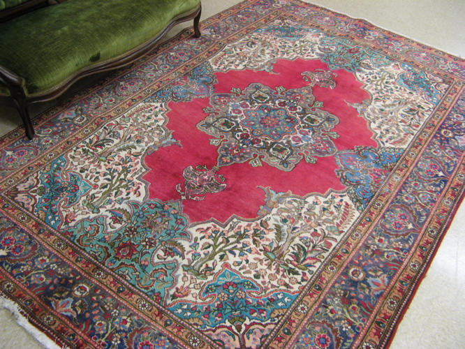 Appraisal: PERSIAN TABRIZ CARPET floral and central floral medallion design on