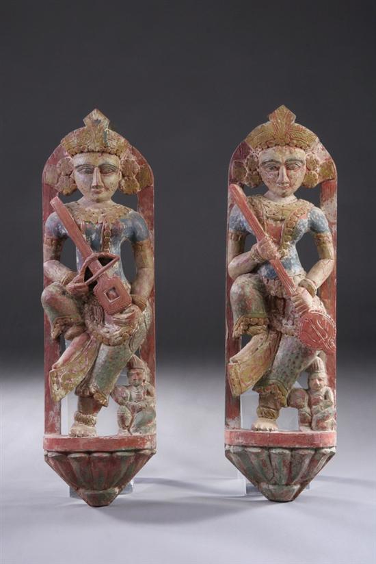 Appraisal: PAIR INDIAN POLYCHROME WOOD FIGURES OF MUSICIANS