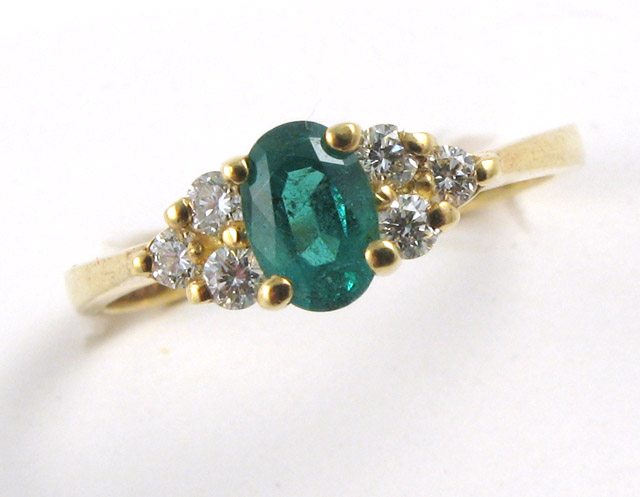 Appraisal: EMERALD DIAMOND AND YELLOW GOLD RING The k gold ring