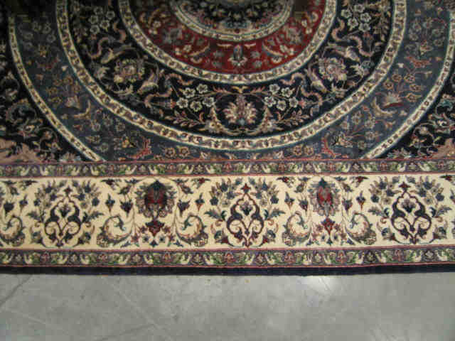 Appraisal: Tabriz Persian Handmade Rug round central medallion blues reds ivory