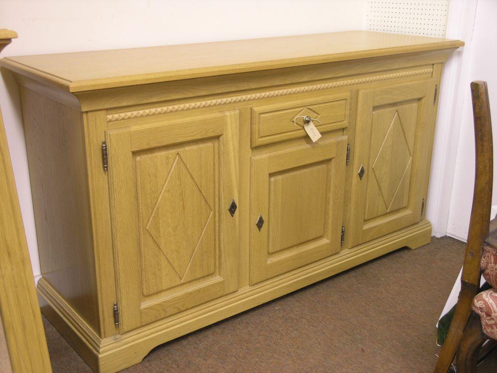 Appraisal: A modern Belgian oak sideboard with dentil mouldings fitted with