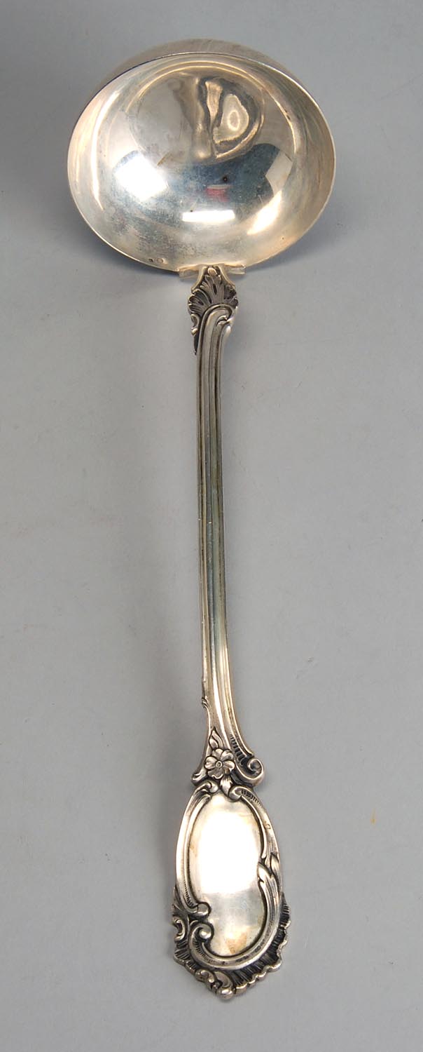 Appraisal: GERMAN SILVER SOUP LADLE With scroll and flower design on