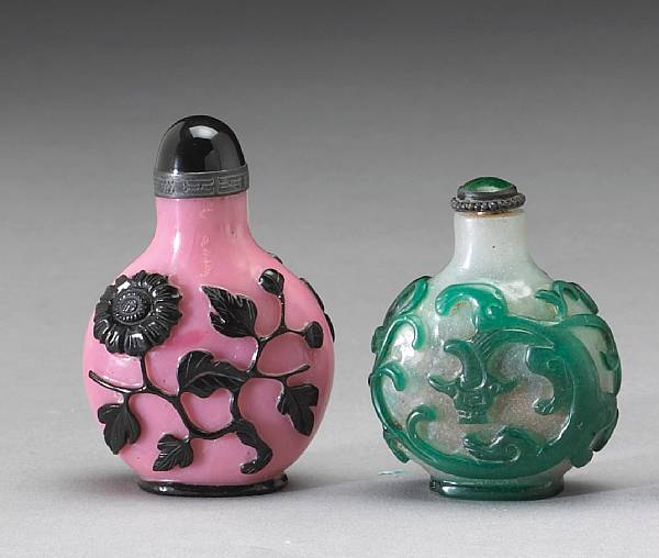 Appraisal: Two overlay glass snuff bottles One with black flowering sprays