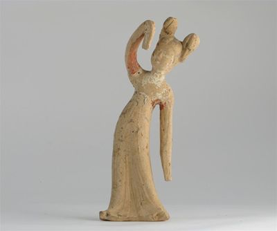 Appraisal: A Chinese pottery model of a woman she stands in