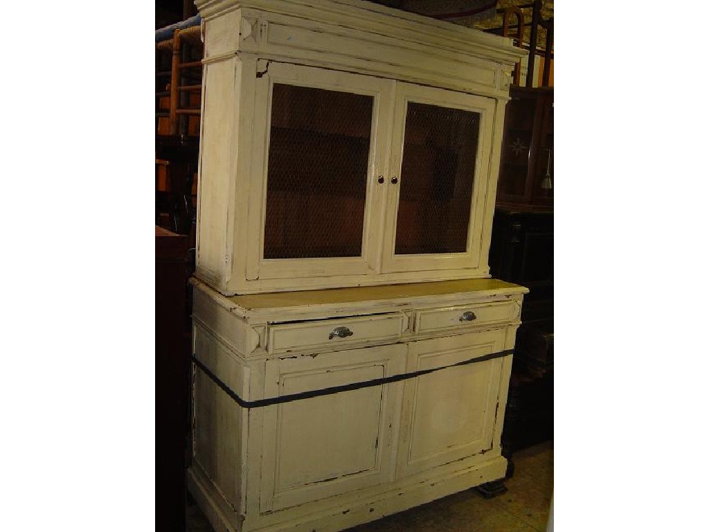 Appraisal: A continental painted pine kitchen cupboard the lower section enclosed