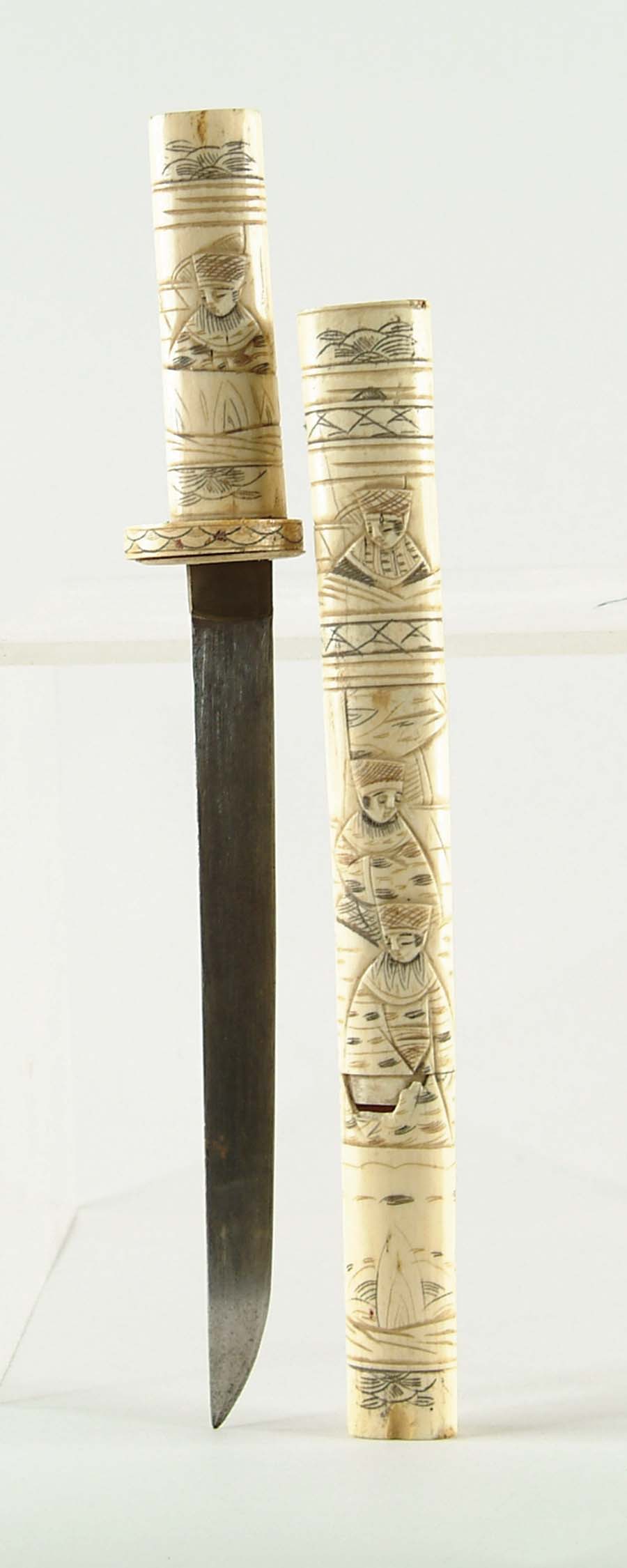 Appraisal: ORIENTAL SMALL SCRIMSHAW IVORY SWORD - blade fastened to an