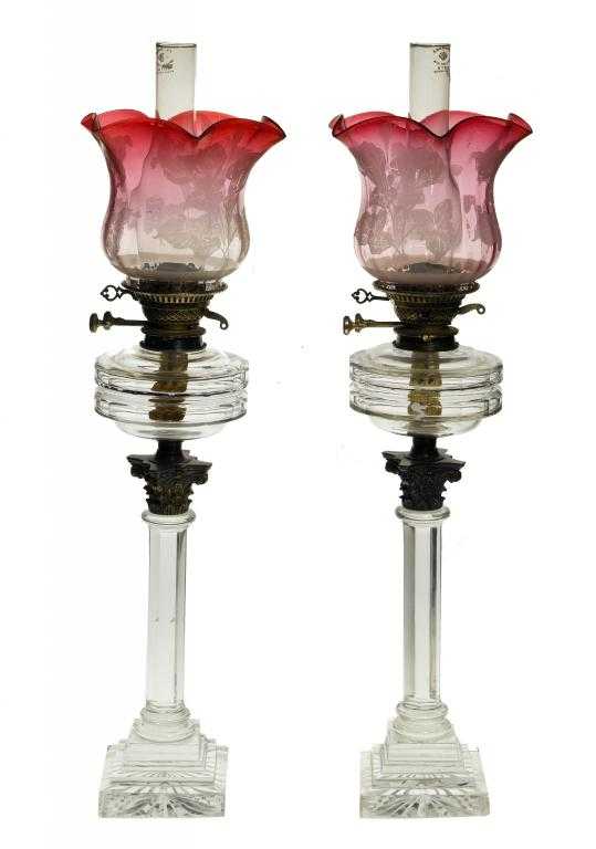 Appraisal: A PAIR OF VICTORIAN GLASS OIL LAMPS the faceted fount