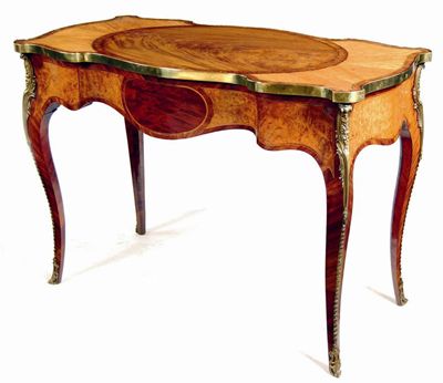 Appraisal: A George III mahogany and brass mounted serpentine side table