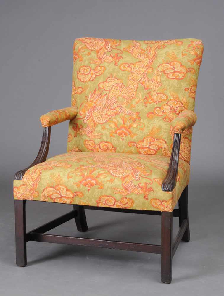 Appraisal: GEORGE III STYLE CARVED MAHOGANY LIBRARY ARMCHAIR With padded back