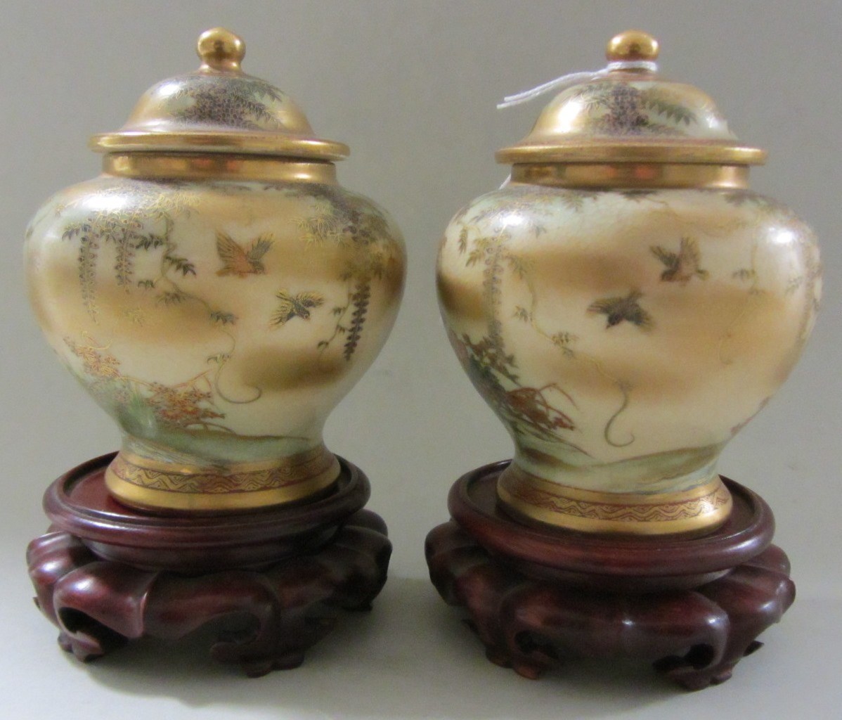 Appraisal: A pair of small Japanese satsuma baluster vases and covers