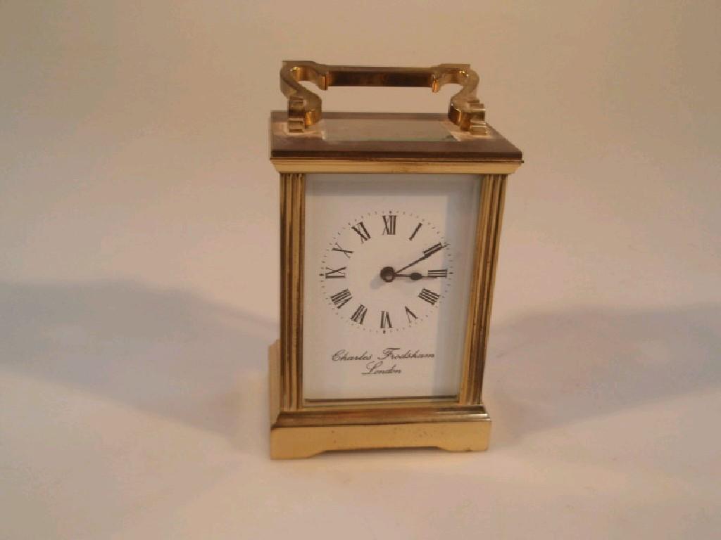 Appraisal: A brass cased carriage clock with visible escapement and white