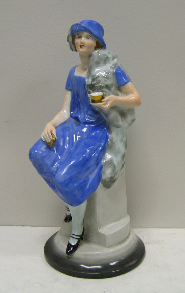 Appraisal: SHELLEY GIRL' PORCELAIN ADVERTISING STATUETTE A rare Shelley seated figure