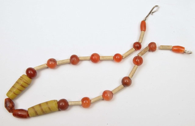 Appraisal: A CORNELIAN AND GLASS BEAD NECKLACE cm