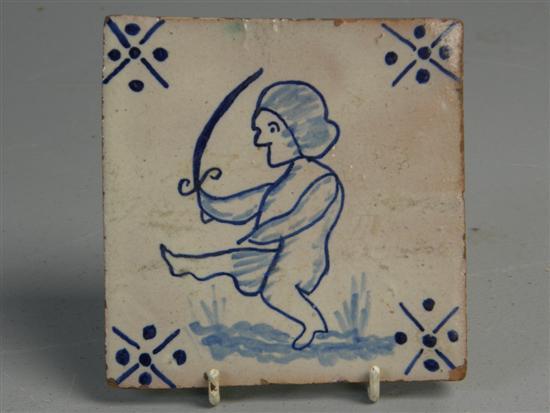 Appraisal: Delft blue and white tile painted with a figure brandishing