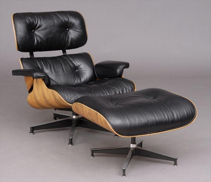 Appraisal: CHARLES EAMES ROSEWOOD-VENEERED MOLDED PLYWOOD AND BUTTONED LEATHER SWIVEL ARMCHAIR