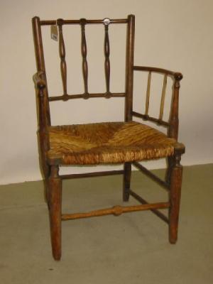 Appraisal: AN ASH SUSSEX ARM CHAIR of usual spindle back form