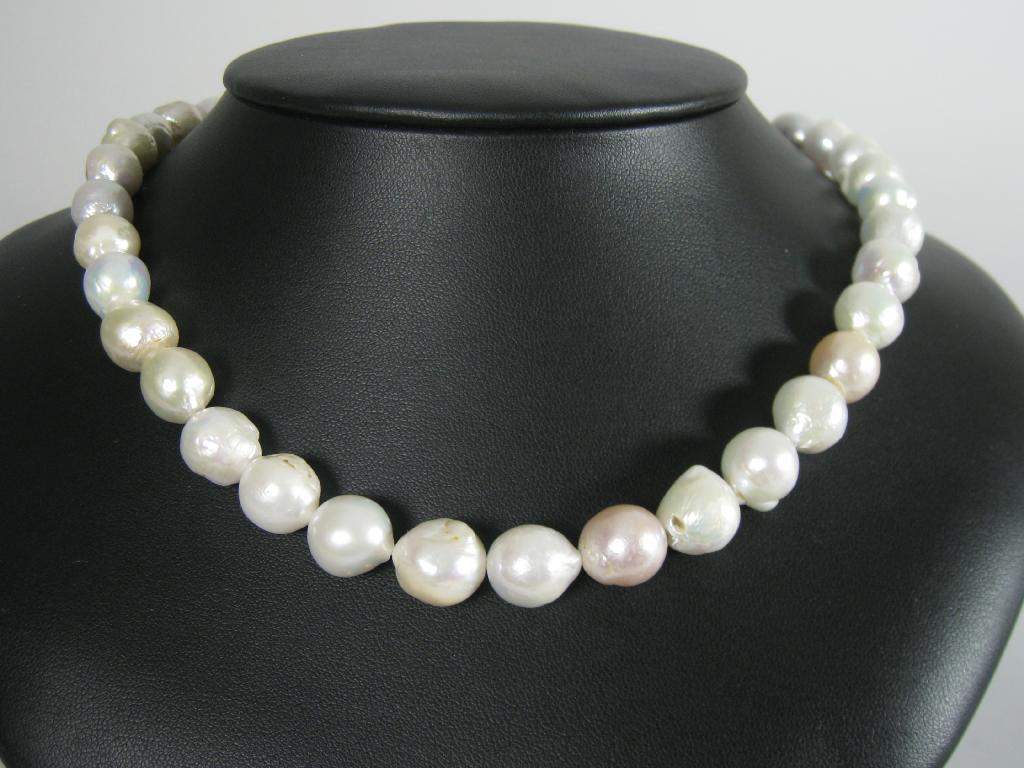 Appraisal: A Baroque Pearl Necklace with silver T bar clasp ins