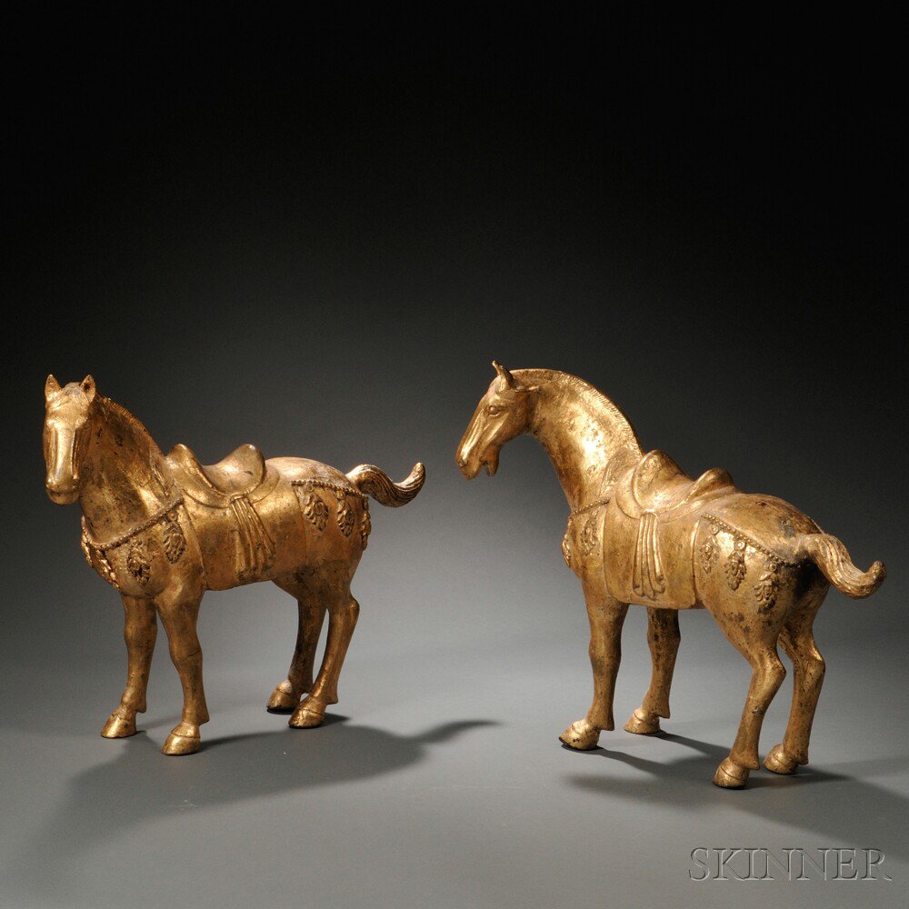 Appraisal: Pair of Gilt-metal Horses China Tang-style the caparisoned animals depicted