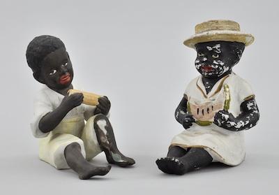 Appraisal: Two Black Americana Bisque Children Figurines Bisque polychrome figurines of