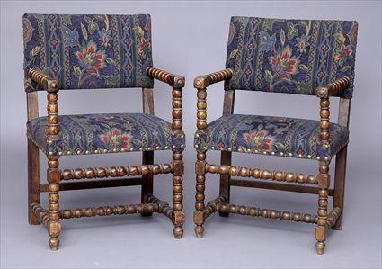 Appraisal: PAIR OF CONTINENTAL BAROQUE WALNUT ARMCHAIRS Each with padded back