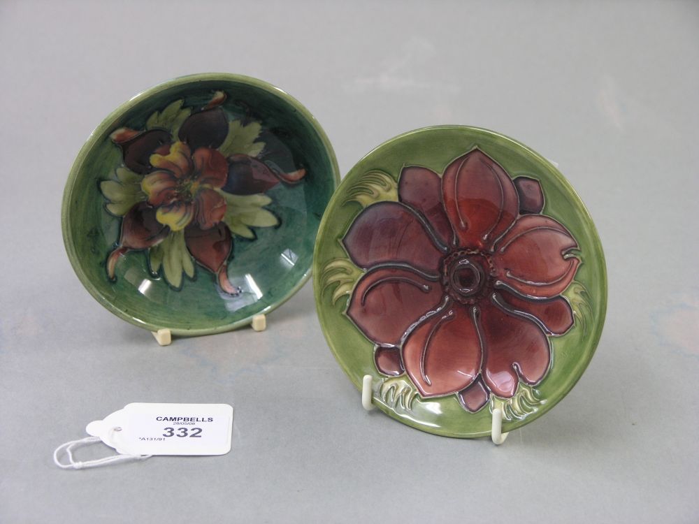 Appraisal: Two Moorcroft dishes Anemone and Clematis both against a green