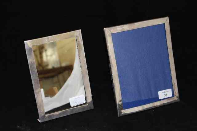 Appraisal: TWO WHITE METAL PHOTO FRAMES the largest x each stamped