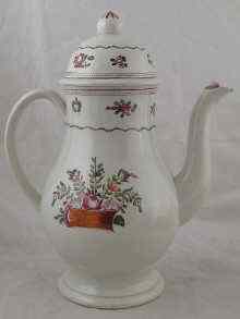 Appraisal: A French ceramic baluster coffeepot the white slip body with