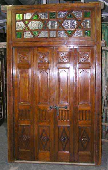 Appraisal: A Northern Indian Moorish Style Teak Double Door with Jamb