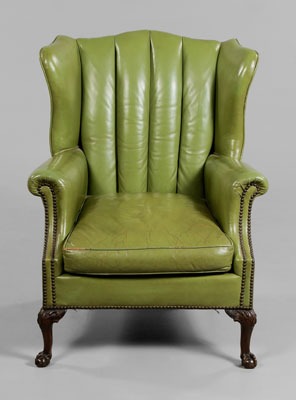 Appraisal: Leather-Upholstered Wing Chair early th century lime-green upholstery with brass