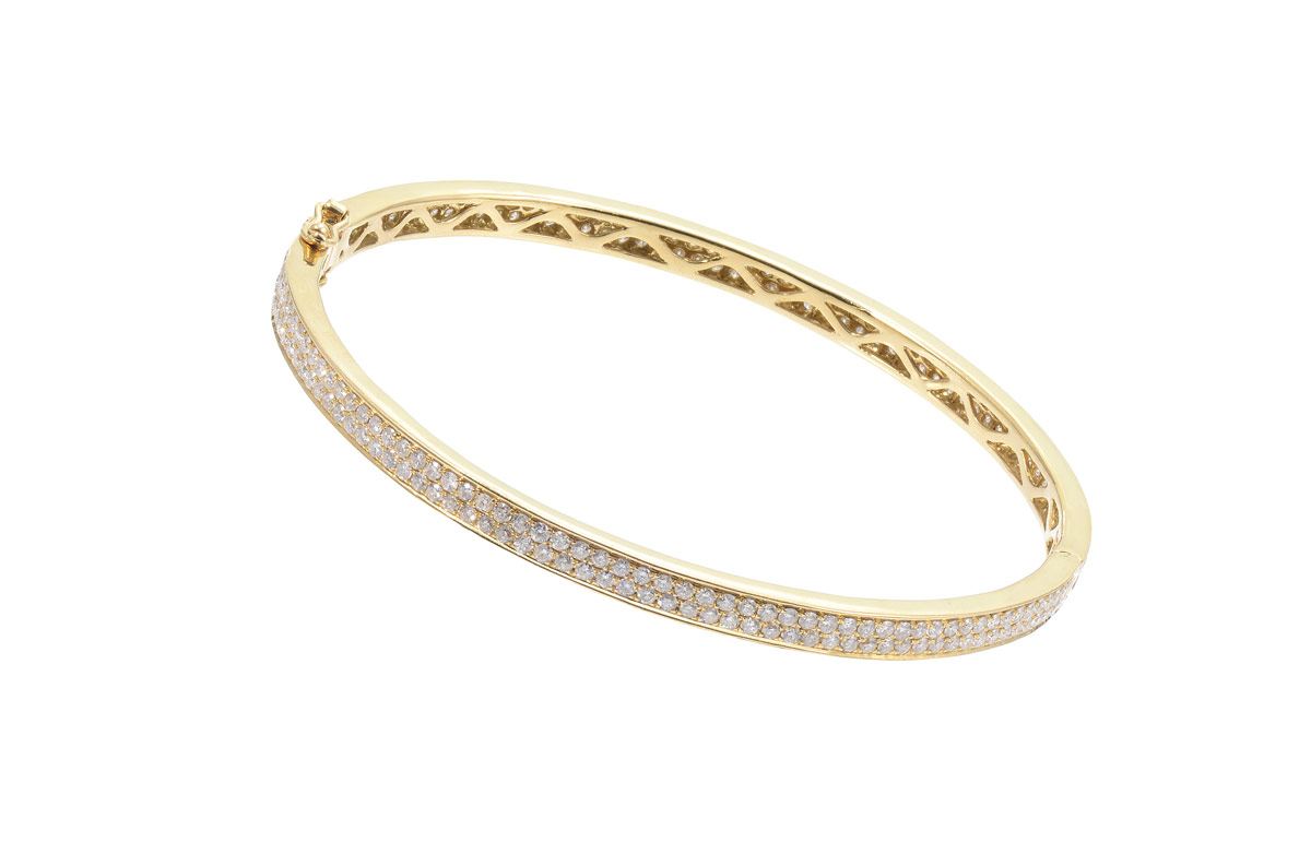 Appraisal: K PAVE DIAMOND BANGLE BRACELET K yellow gold hinged bangle